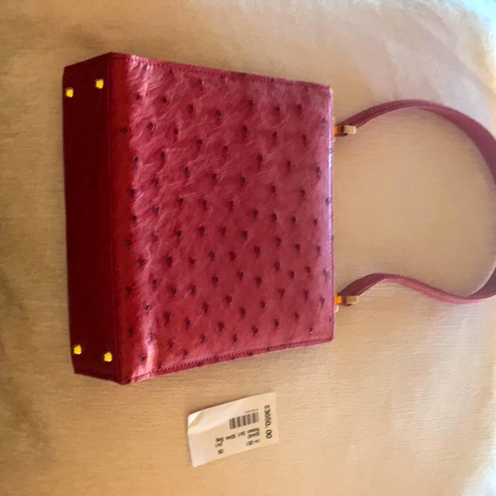 Beautiful ostrich red leather Giorgio’s Palm Beach bag. Never used.